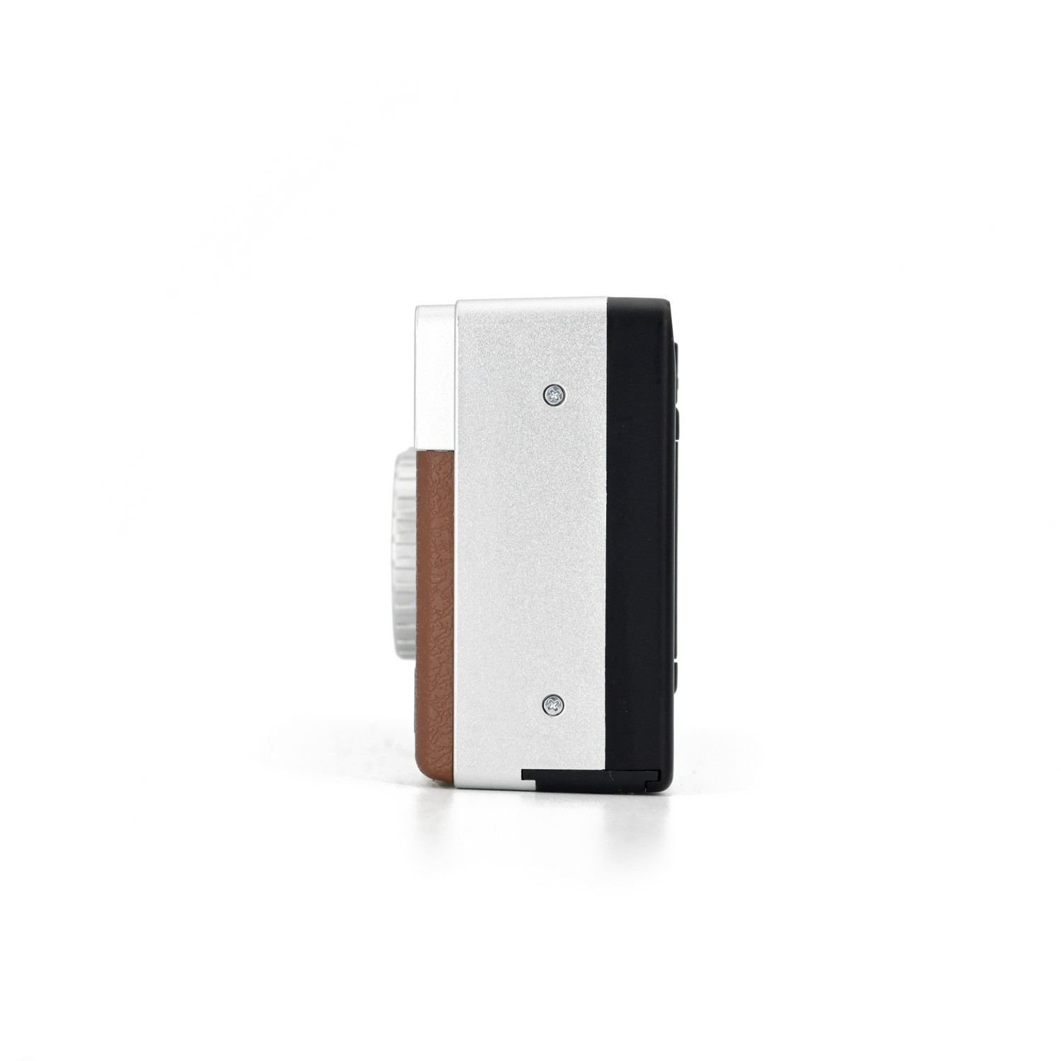 A small silver, brown, and black camera is shown from the side on a white background.