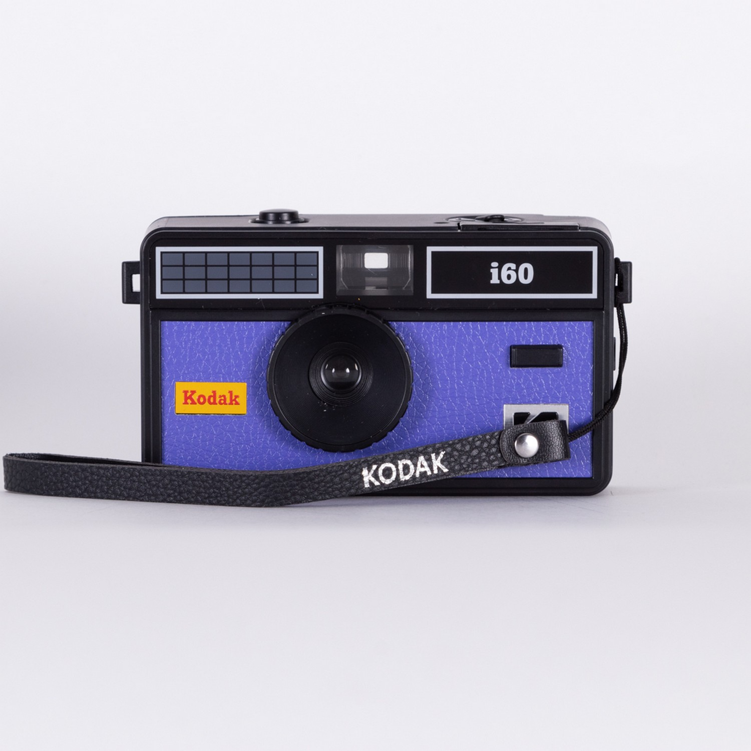 Kodak i60 camera. Blue body, black lens, and a black strap. The Kodak logo is on the front of the camera.