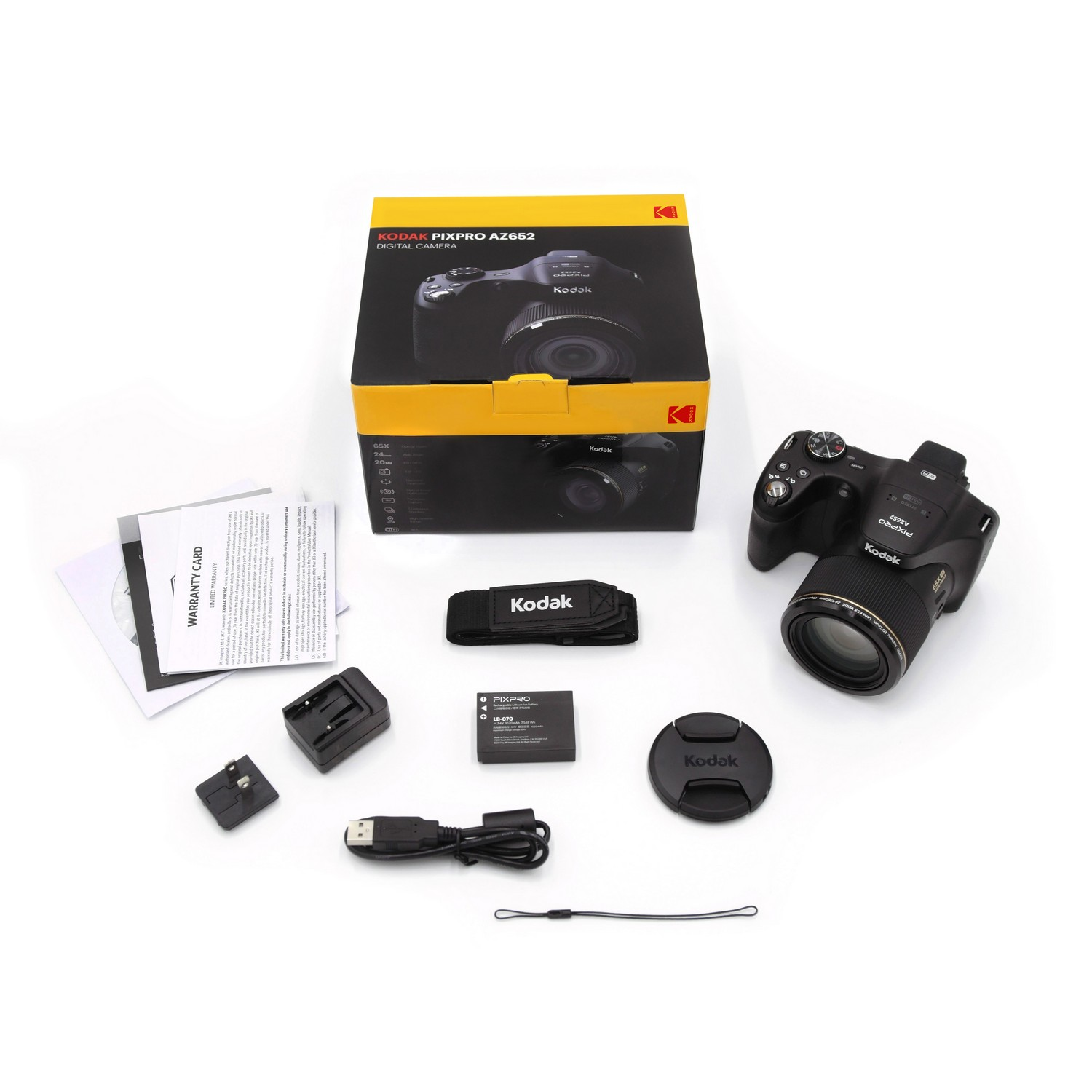 Appareil photo Kodak Pixpro AZ652 avec accessoires : boîte, chargeur, batterie, bouchon d'objectif, sangle.