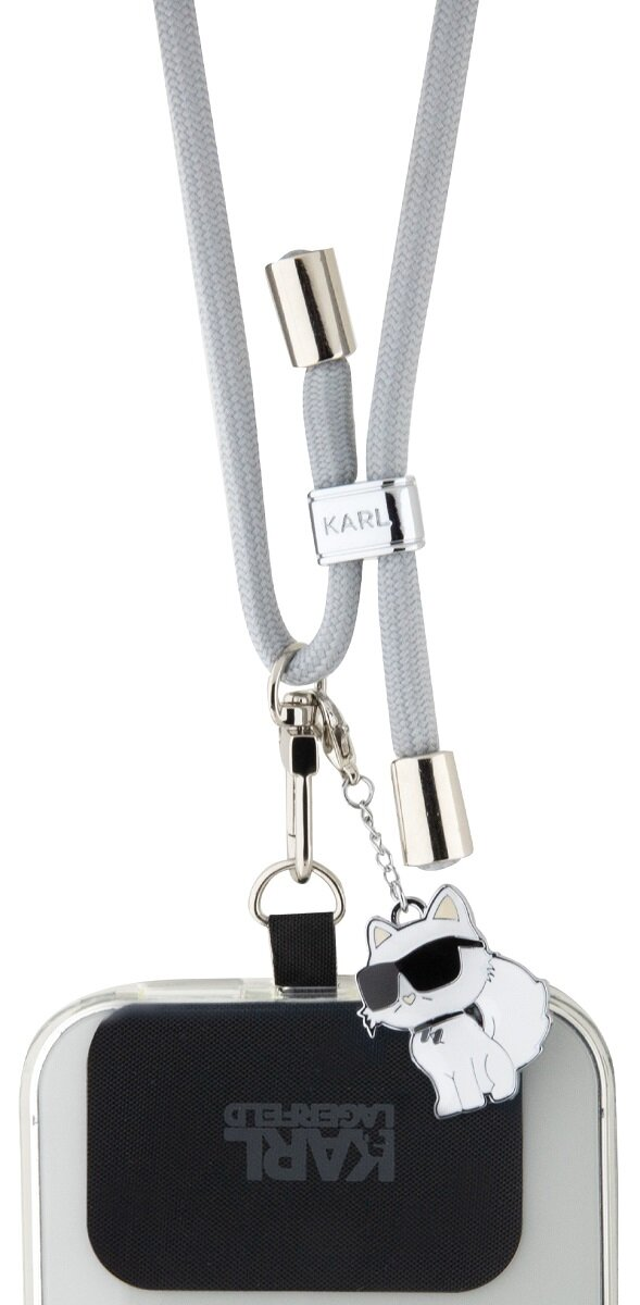 Etui na telefon z szarym paskiem. Pasek ma markę KARL LAGERFELD i zawieszkę.