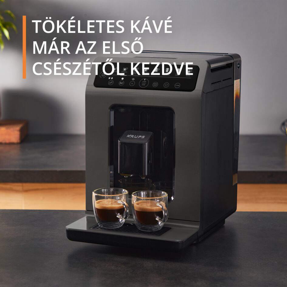 Egy sötétszürke Krups kávéfőző két üvegpohár kávéval és szöveg overlay-jel.