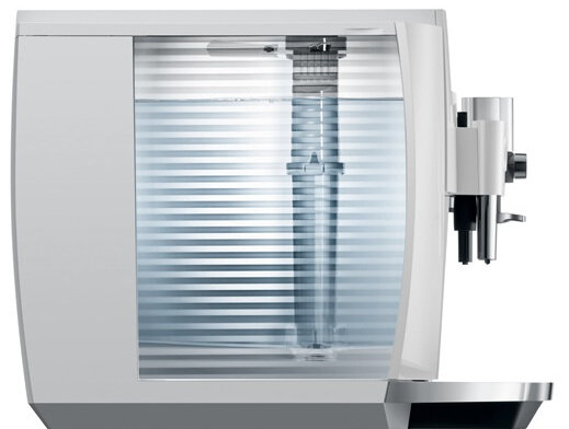 Biały ekspres do kawy z przezroczystym zbiornikiem na wodę.