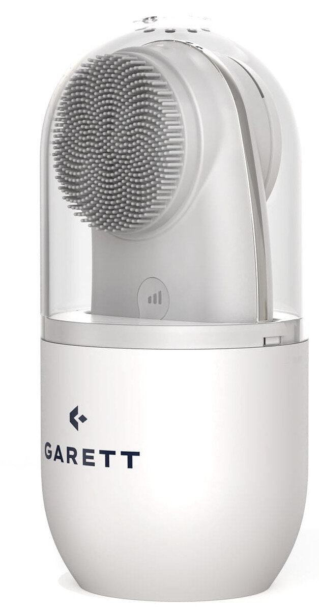 Biała szczotka do twarzy z przezroczystą osłoną. Nazwa marki 'GARETT' z przodu.