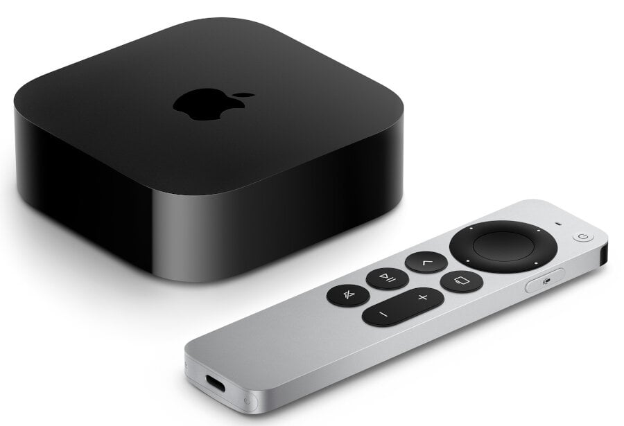 Urządzenie Apple TV i pilot. Urządzenie jest czarne, pilot srebrny z panelem dotykowym.