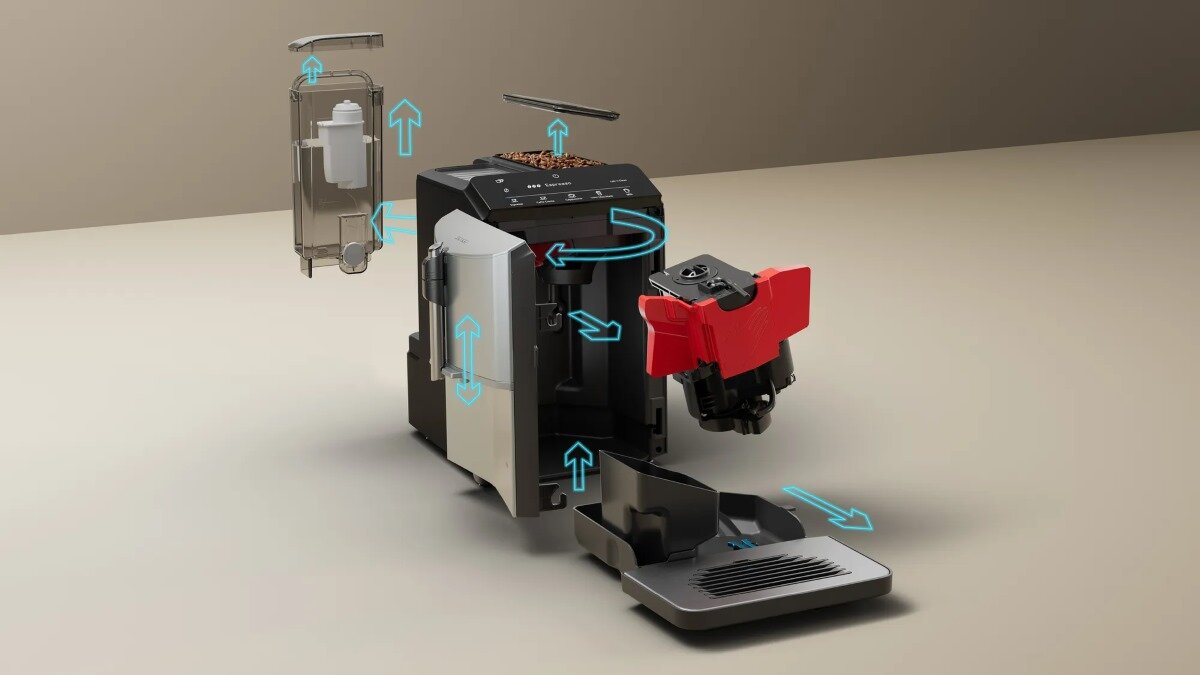 Ekspres do kawy z rozłożonymi częściami, pokazujący zbiornik na wodę, ziarna kawy i mechanizmy wewnętrzne.
