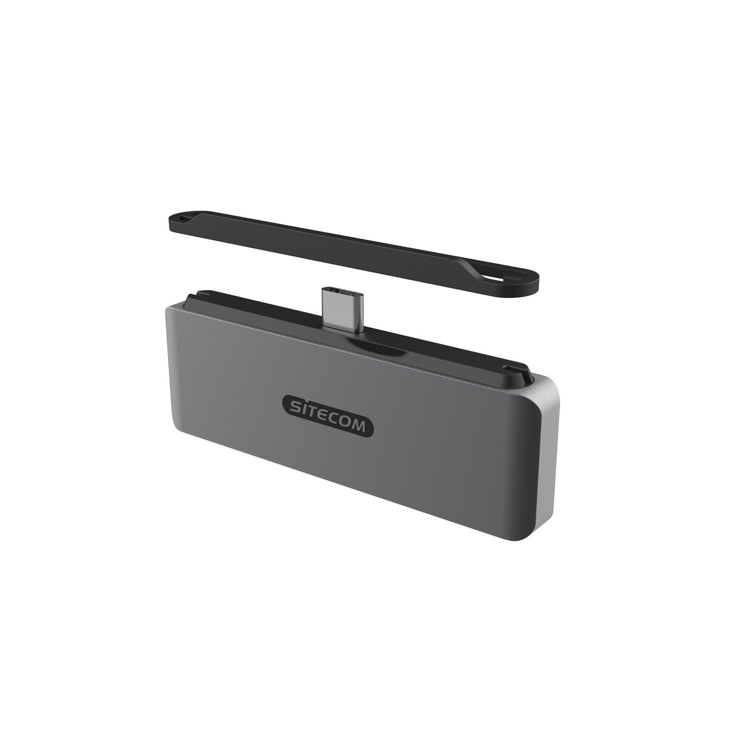 Un hub USB-C SITECOM gris avec un couvercle noir détaché. Le hub est sur une surface blanche.