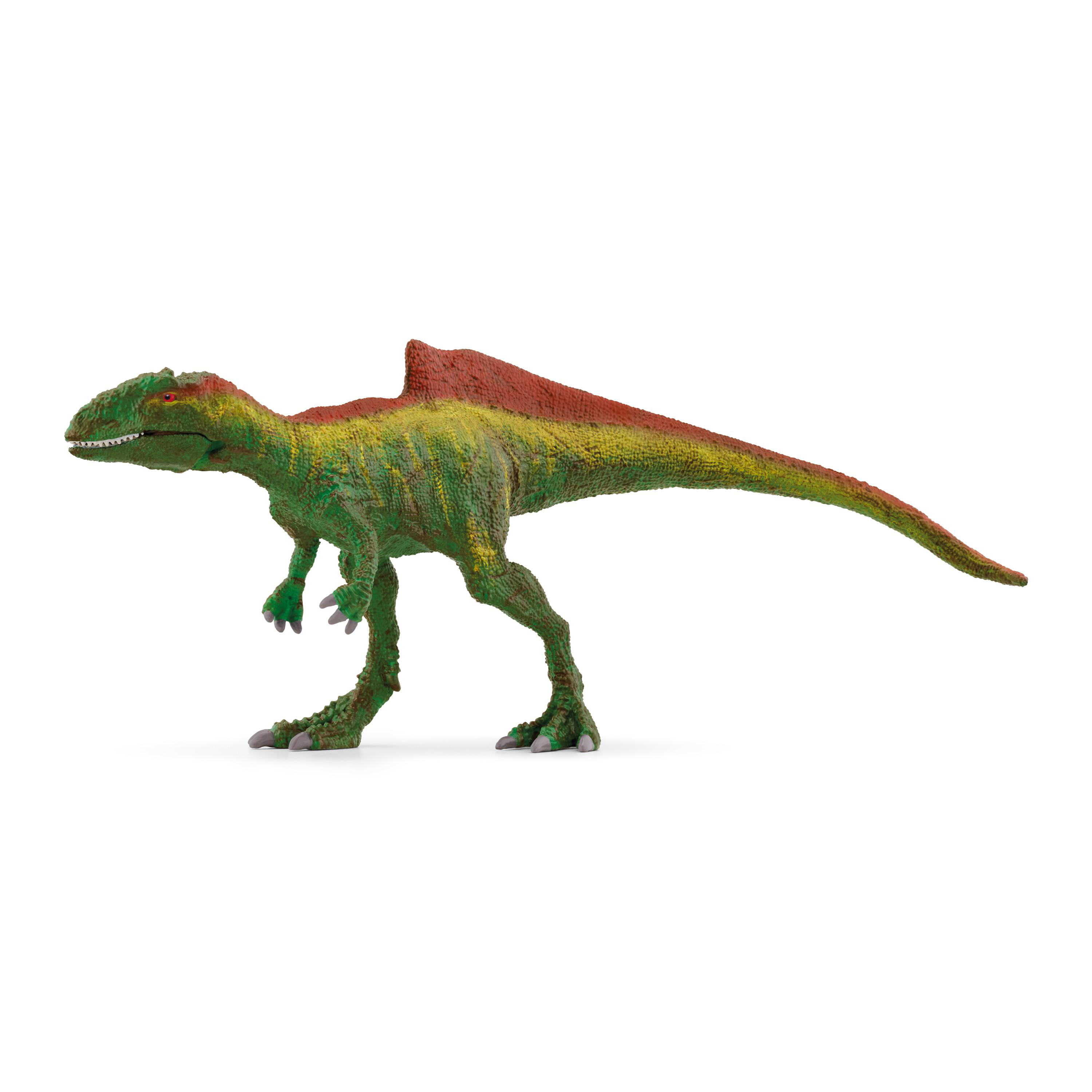 Ein grünes, gelbes und rotes Dinosaurier-Spielzeug auf weißem Hintergrund.