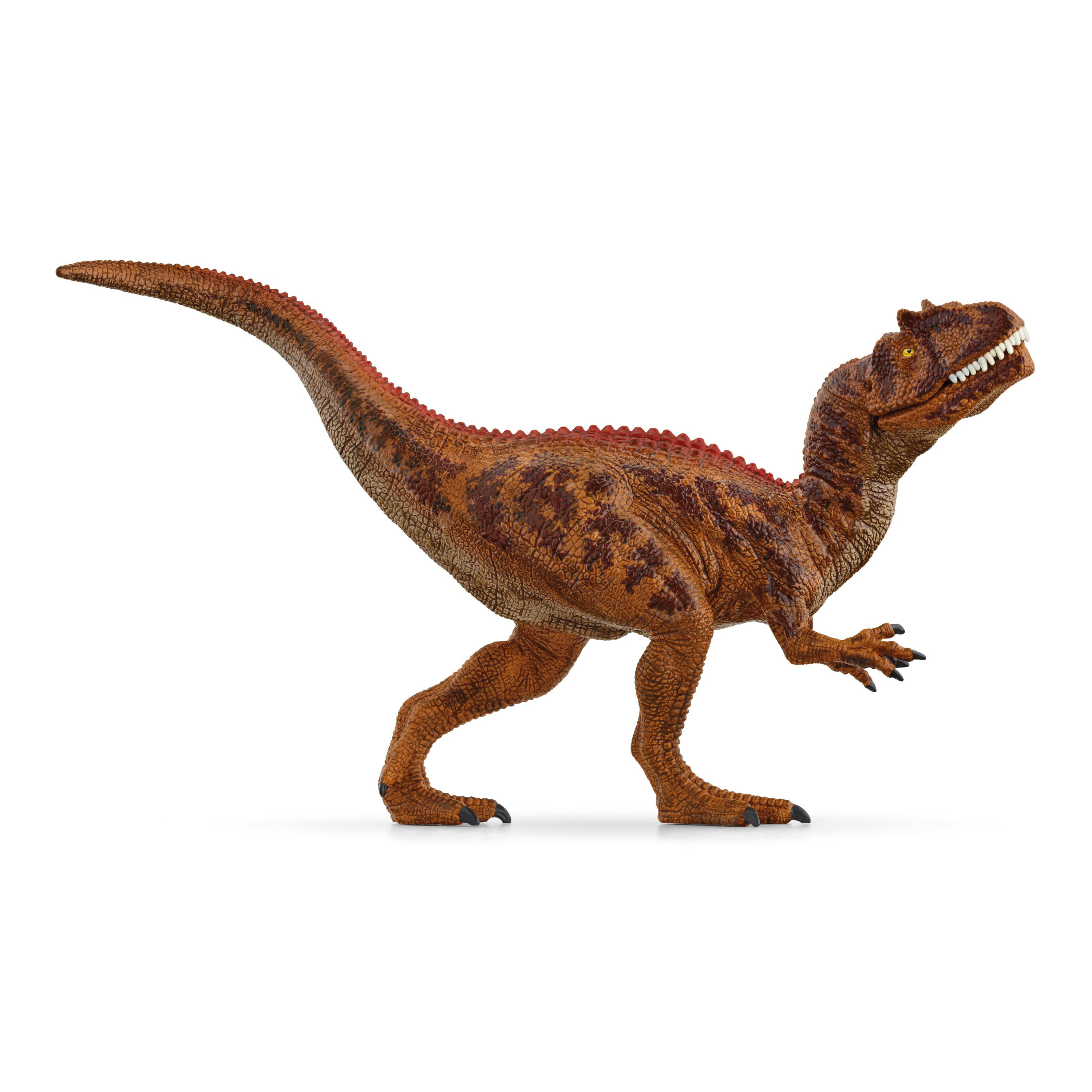 Ein braunes und rotes Dinosaurier-Spielzeug auf weißem Hintergrund.