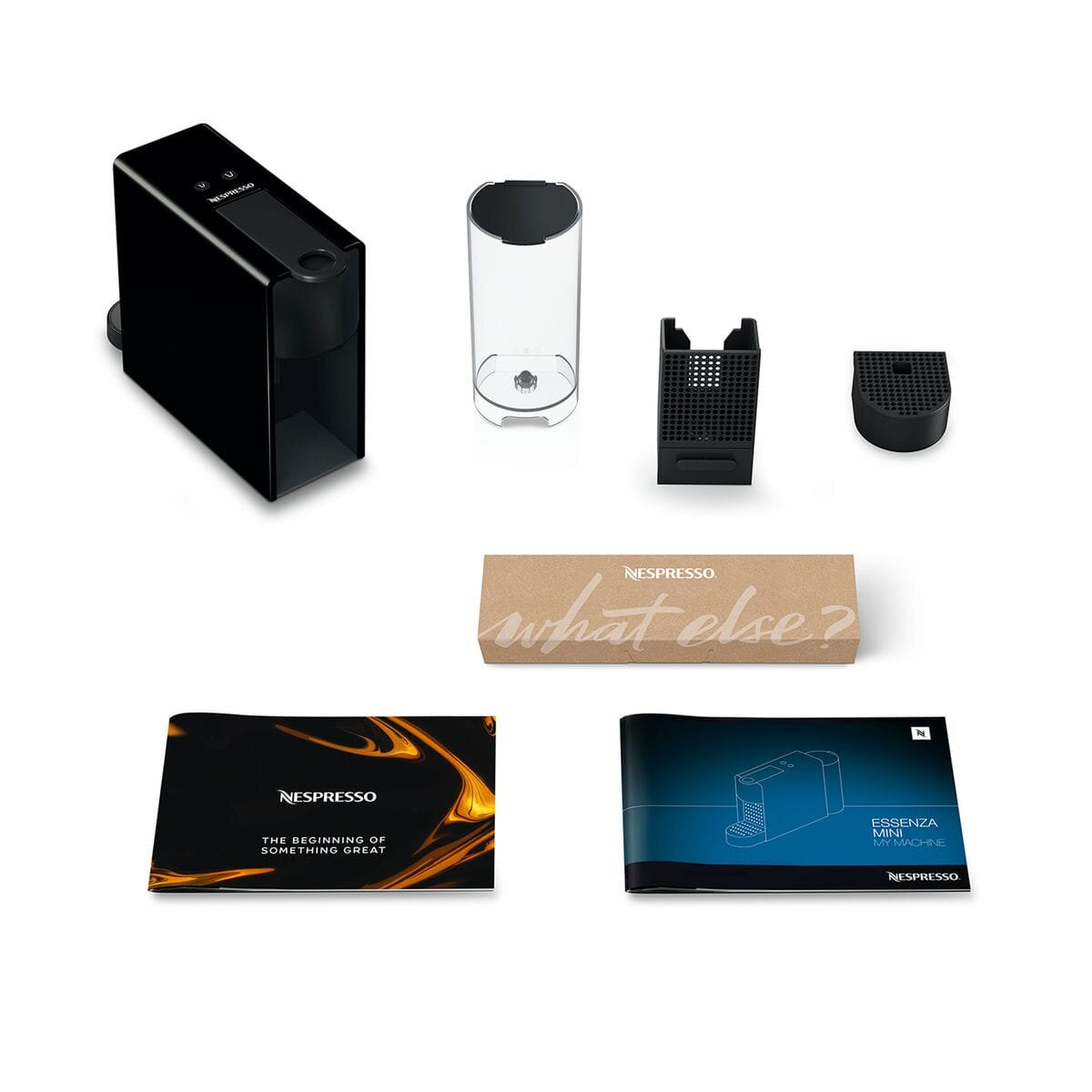 Części ekspresu Nespresso: czarny korpus, zbiornik na wodę, taca i broszury na białej powierzchni.