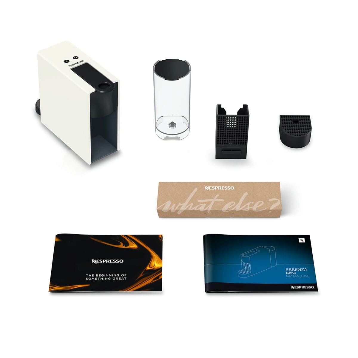Ekspres do kawy Nespresso i jego akcesoria. Maszyna jest biało-czarna.
