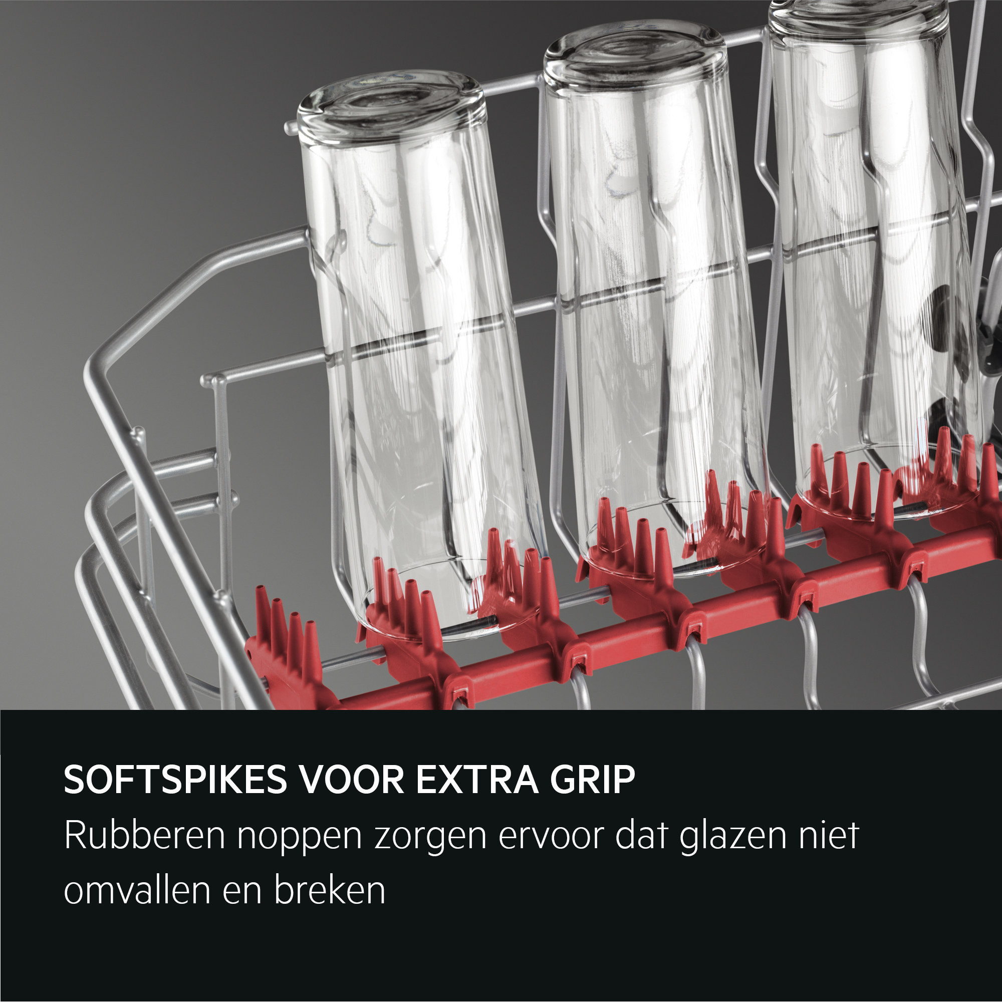 Een vaatwasrek met drie glazen. Rode spikes houden de glazen op hun plaats. Tekst: SOFTSPIKES FOR EXTRA GRIP