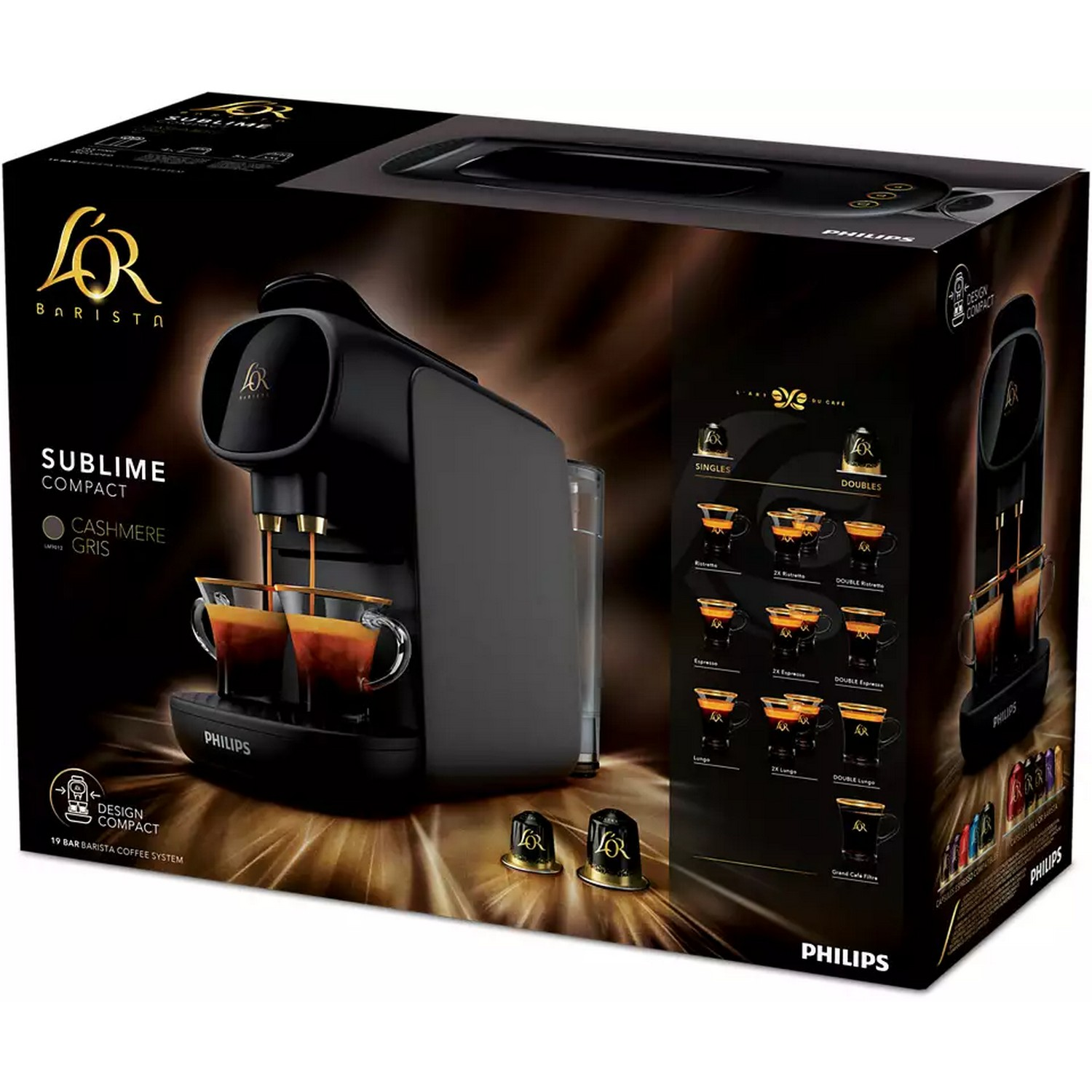 Een zwarte L'or Barista Sublime Compact koffiemachine met twee kopjes koffie. Er is een doos.