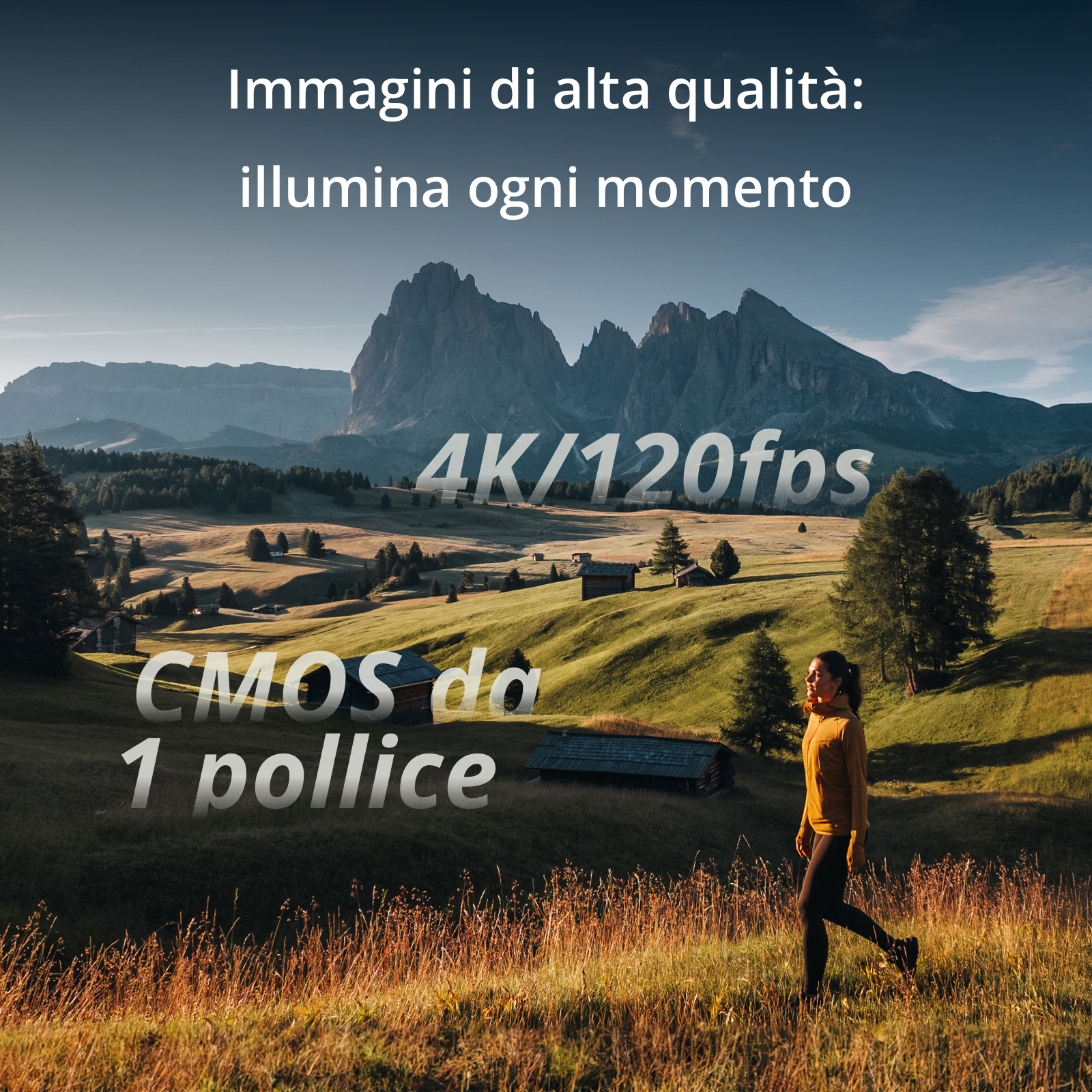 Una donna cammina in un campo con montagne sullo sfondo. Testo sovrapposto: 4K/120fps.
