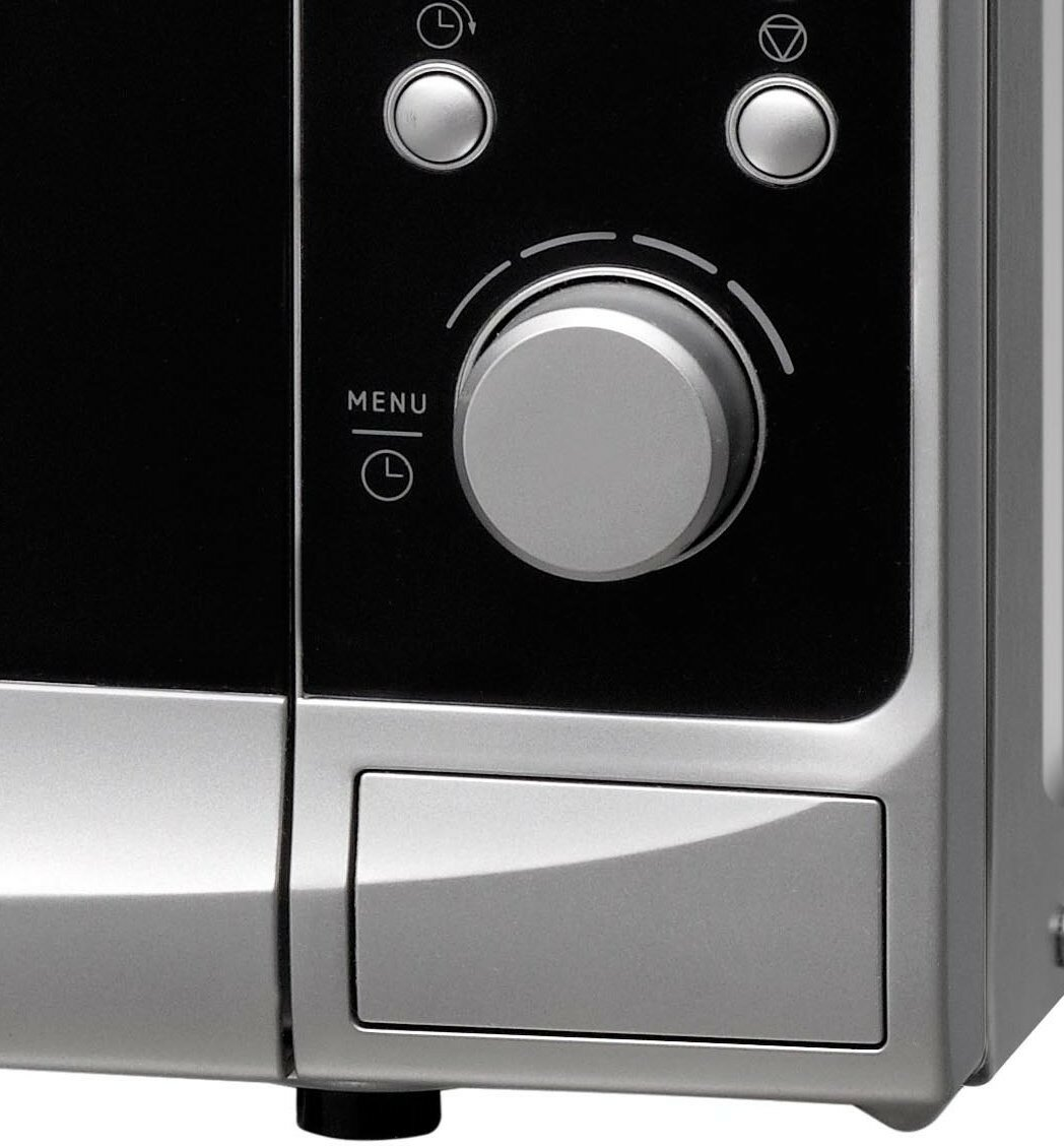 Panel przedni kuchenki mikrofalowej z przyciskami, pokrętłem i małą szufladą. Metaliczne i czarne kolory.