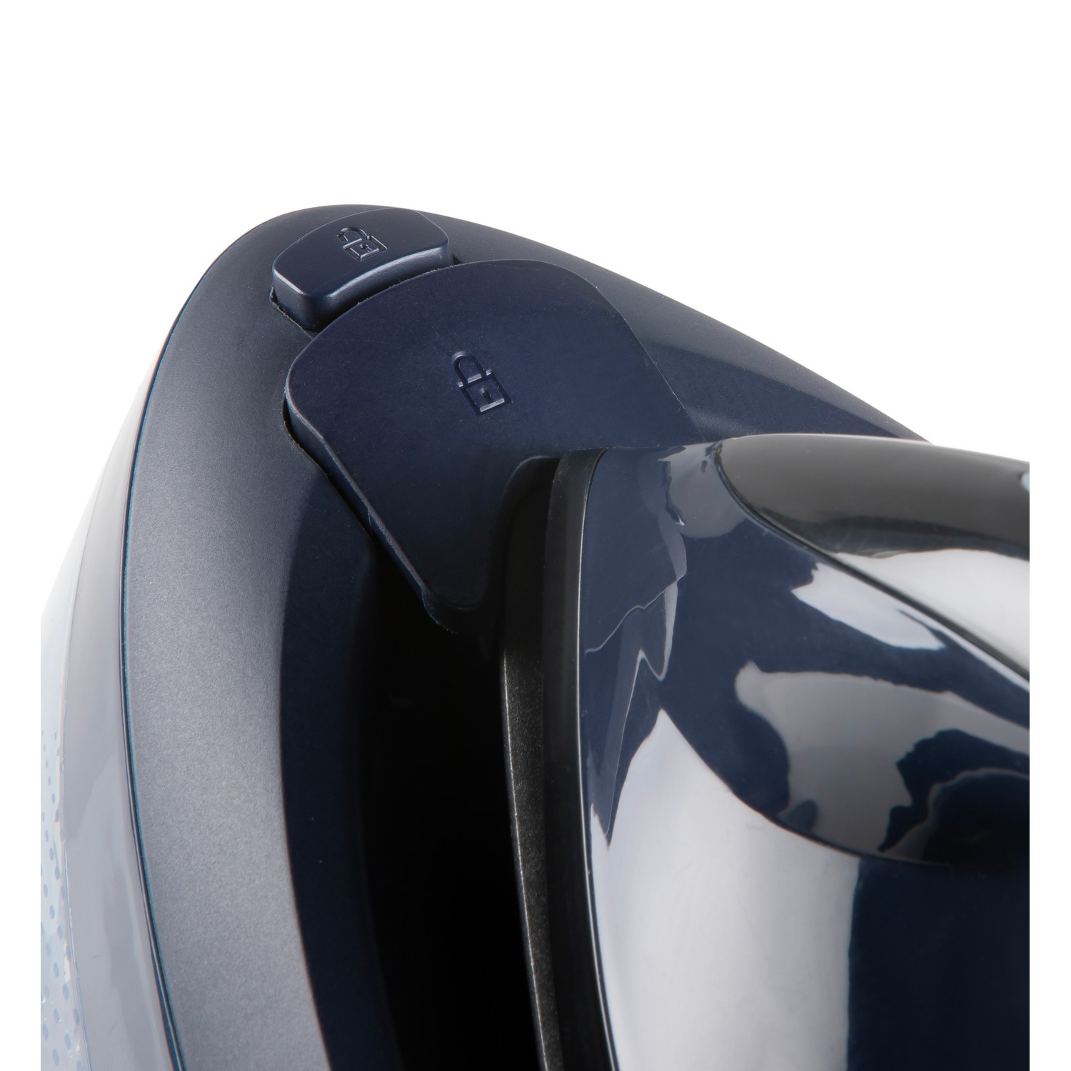 Close-up of a navy blue appliance. A button with a lock symbol is visible.