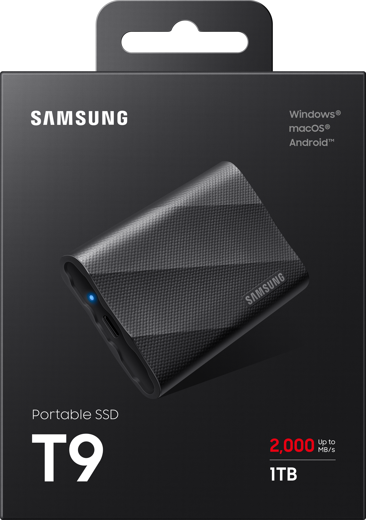 Une boîte SSD portable Samsung T9. La boîte est noire avec du texte blanc. Le SSD est gris foncé.