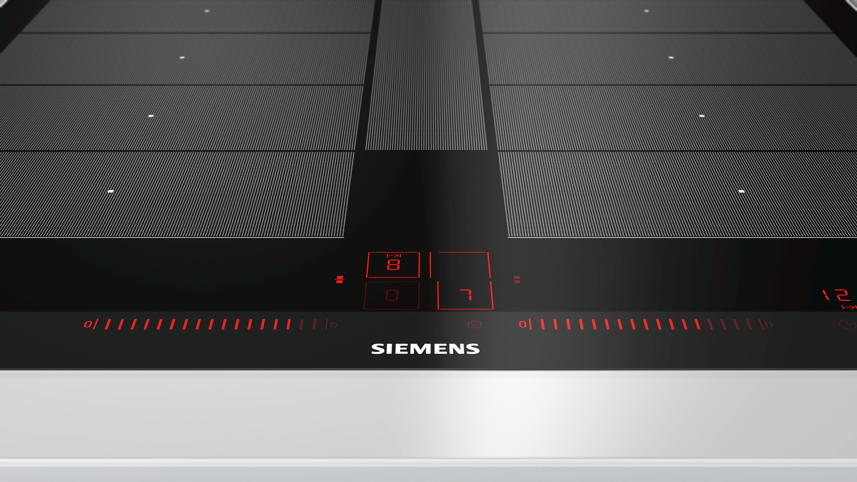 Czarna płyta indukcyjna z czerwonym wyświetlaczem cyfrowym i logo Siemens. Widoczne cyfry 8, 7.