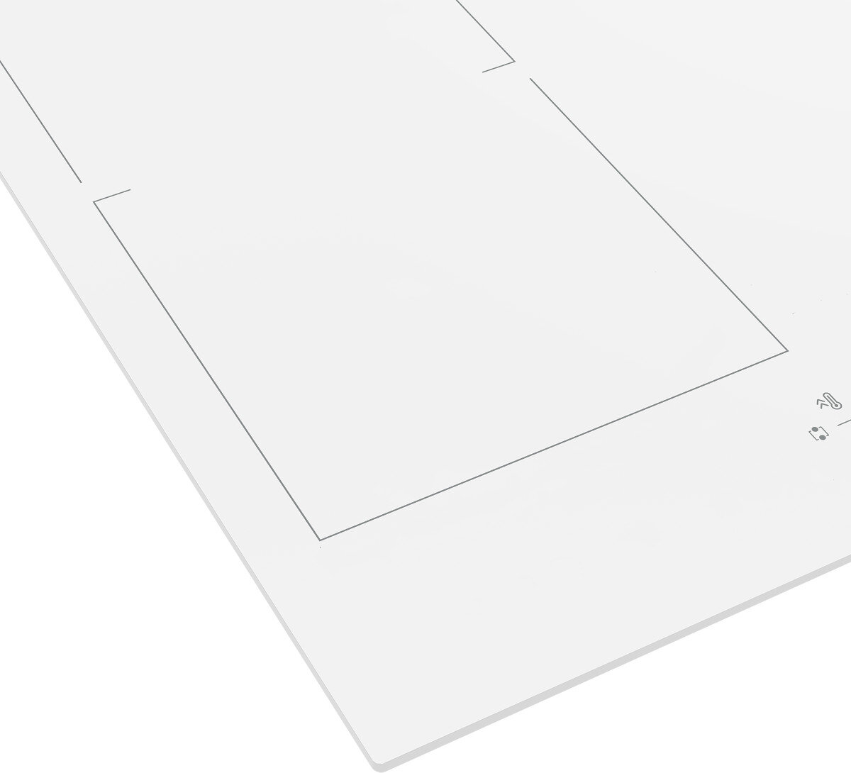 Zbliżenie białej płyty grzewczej ze szkła z zaznaczonymi strefami gotowania.