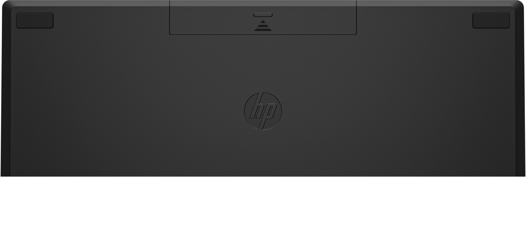 Parte inferior del teclado HP negro con el logotipo de HP, sobre una superficie negra.