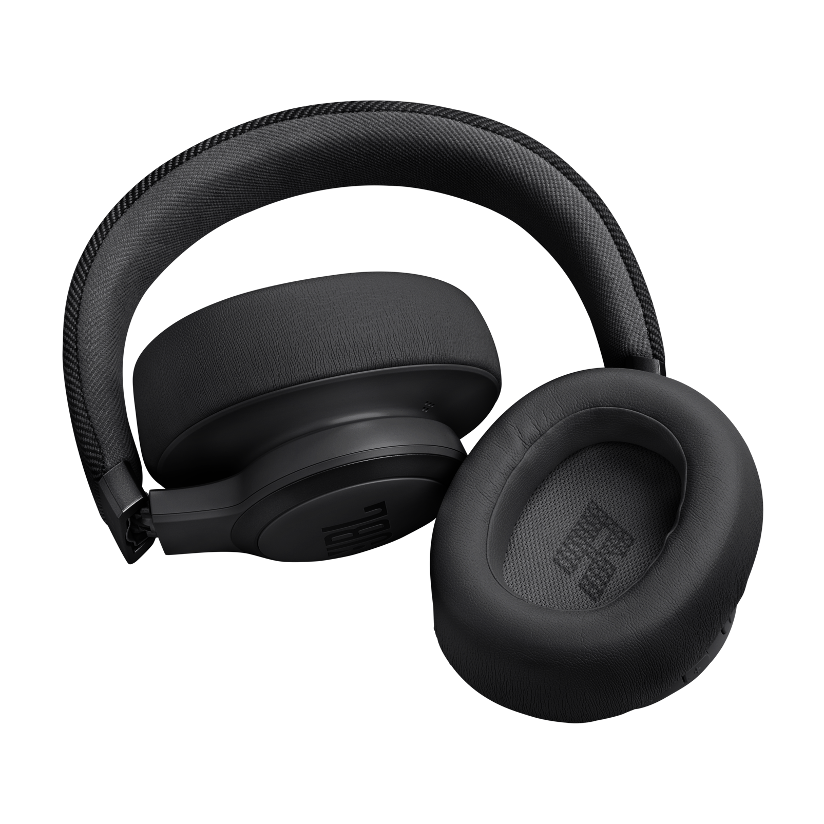 Auriculares negros sobre fondo negro. Son visibles los auriculares.