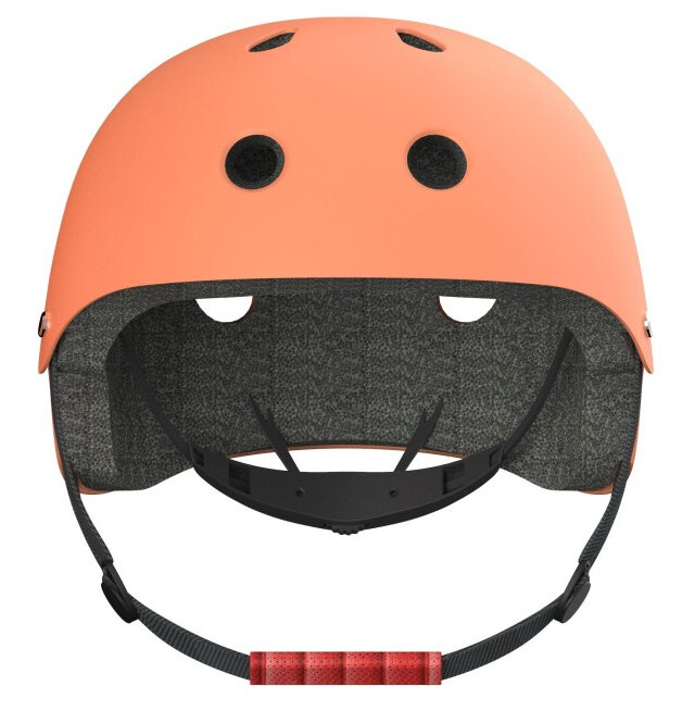 Pomarańczowy kask, otwarty i skierowany w górę. Czarne paski i wyściółka wewnątrz, czerwony uchwyt paska.