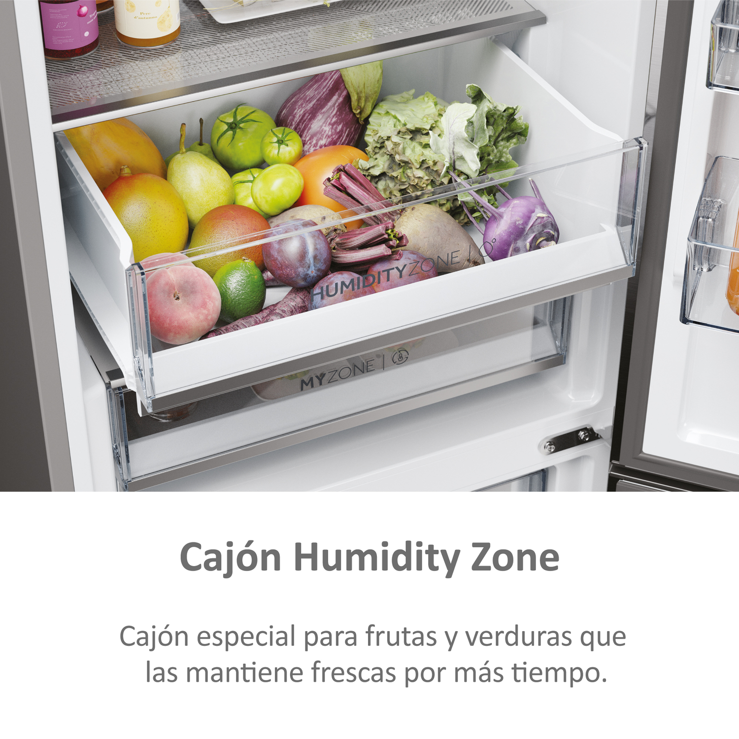 Primer plano del cajón del refrigerador con frutas y verduras. Texto dice Humidity Zone.