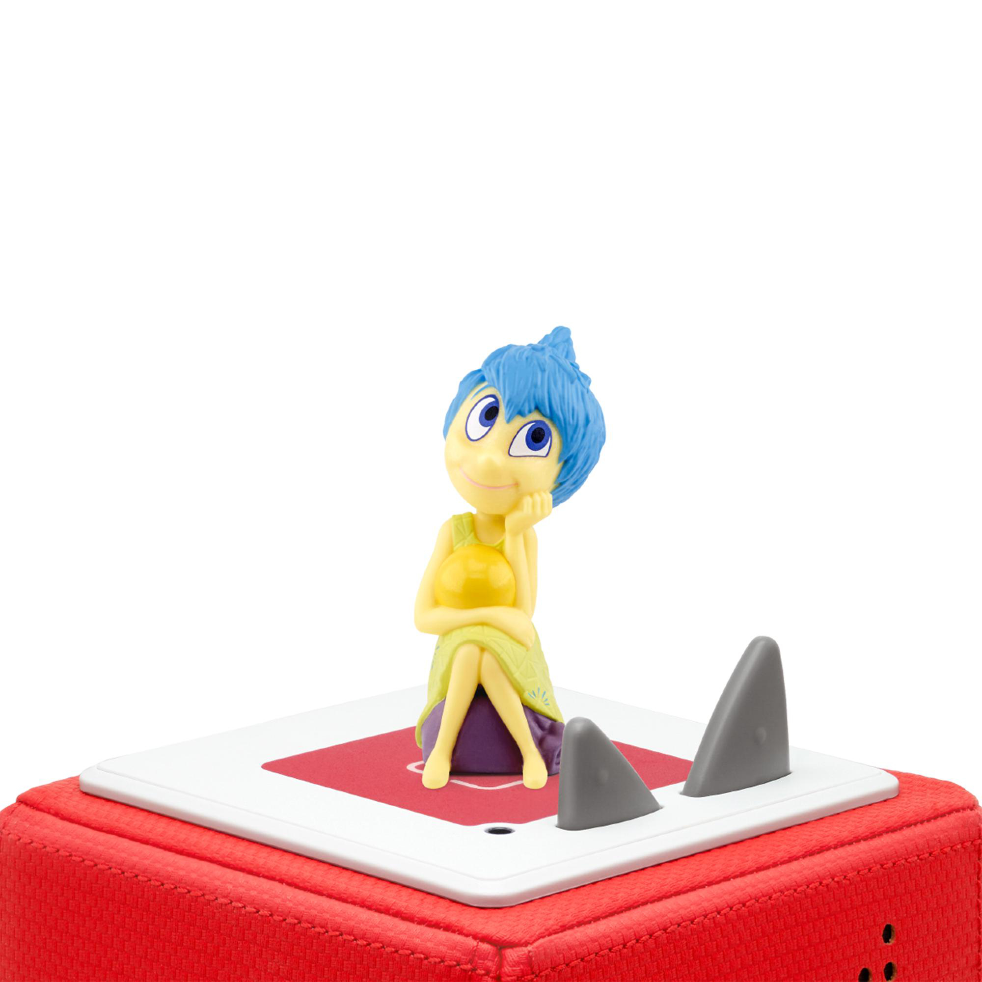 Joy, eine Figur aus Alles steht Kopf, auf einer roten Box.
