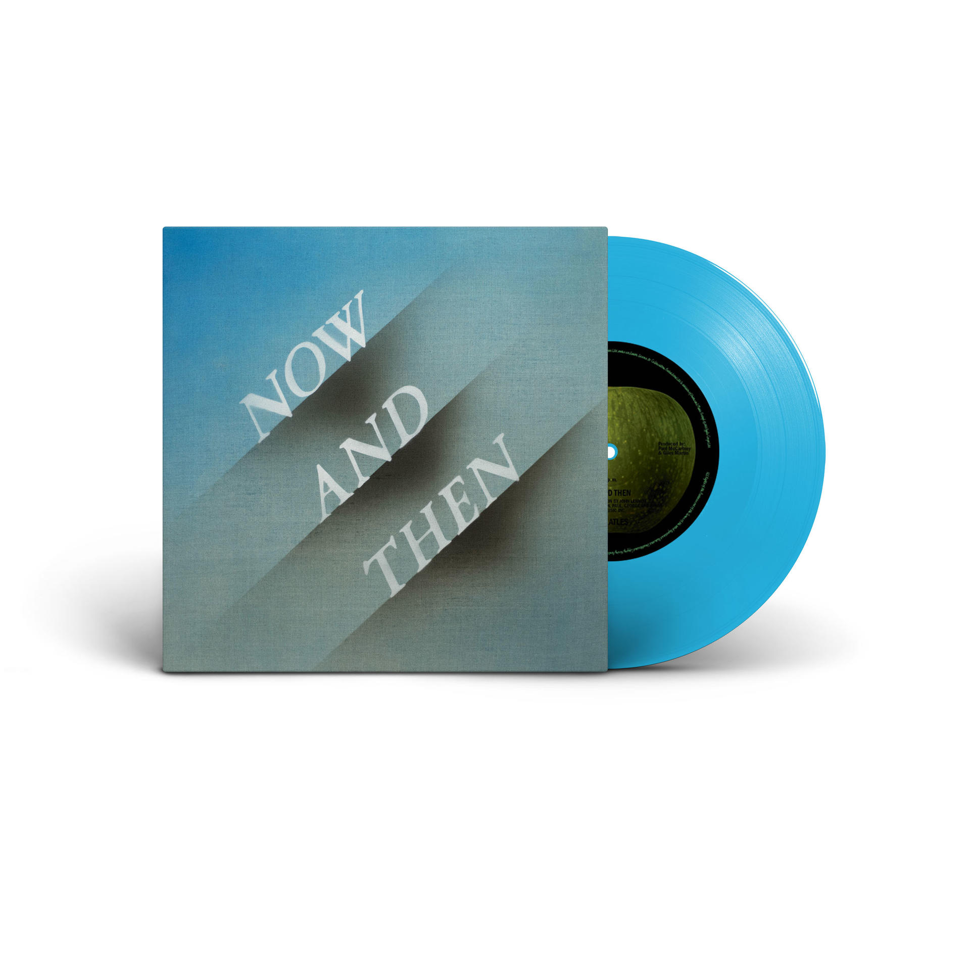 Eine Schallplatte in Hellblau liegt neben einem Cover mit Now and Then.
