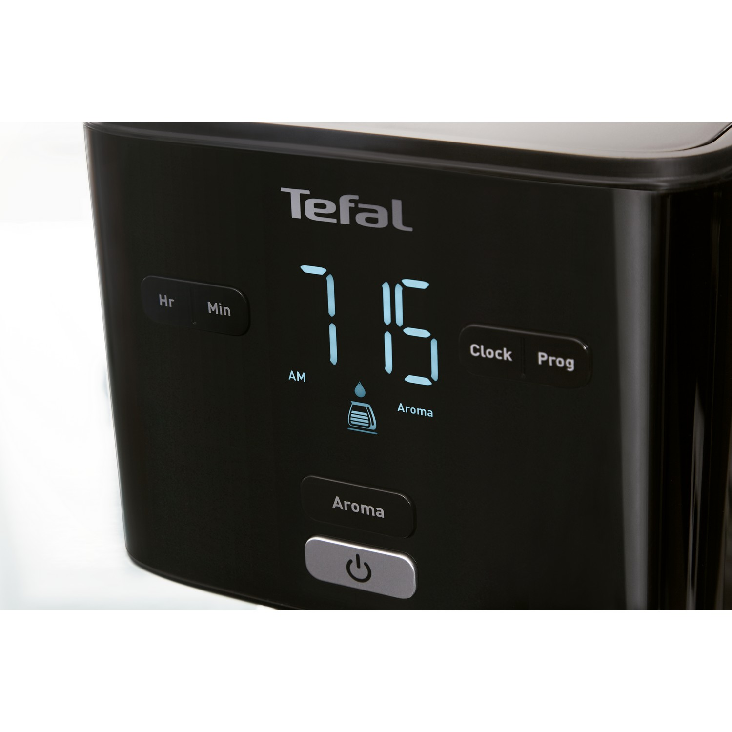 Zwart Tefal koffiezetapparaat bedieningspaneel met 7:15 AM, met aroma- en aan/uit-knoppen.