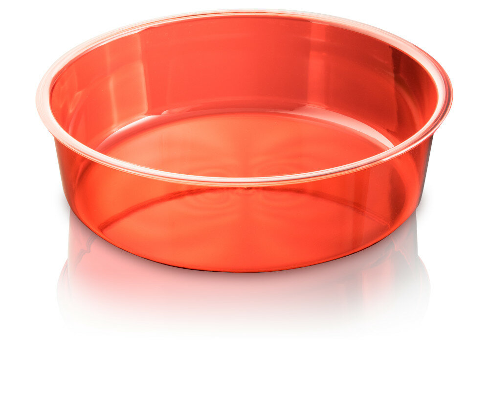 Czerwona, przezroczysta miska na białej powierzchni, odbijająca się na powierzchni pod spodem.