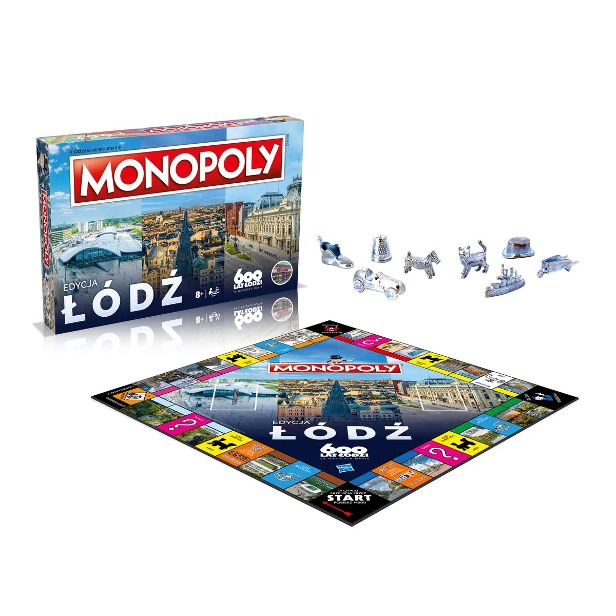 Pudełko i plansza gry Monopoly. Pudełko zawiera obrazy miasta. Po prawej stronie znajdują się pionki.