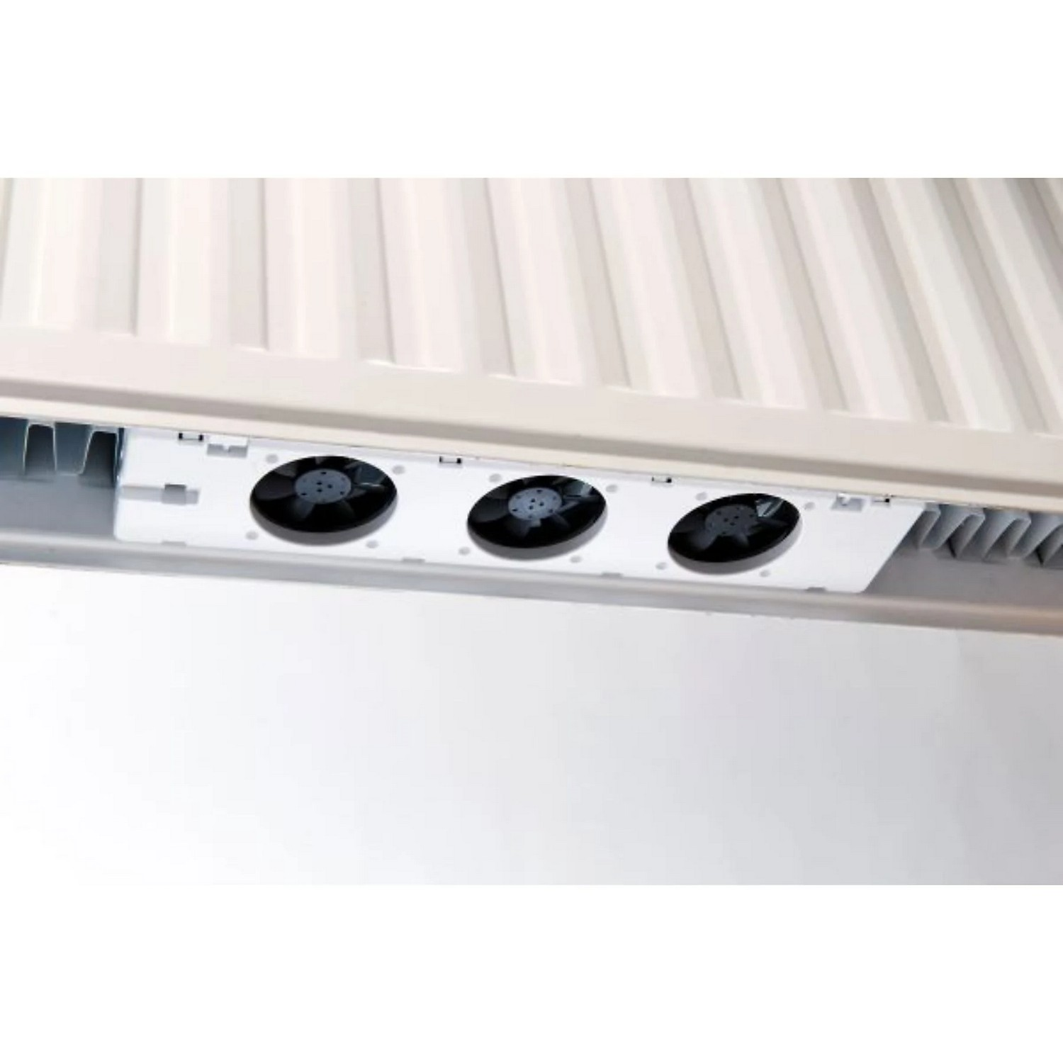 Three black fans visible from the bottom, with a white base. It is a part of a machine.
