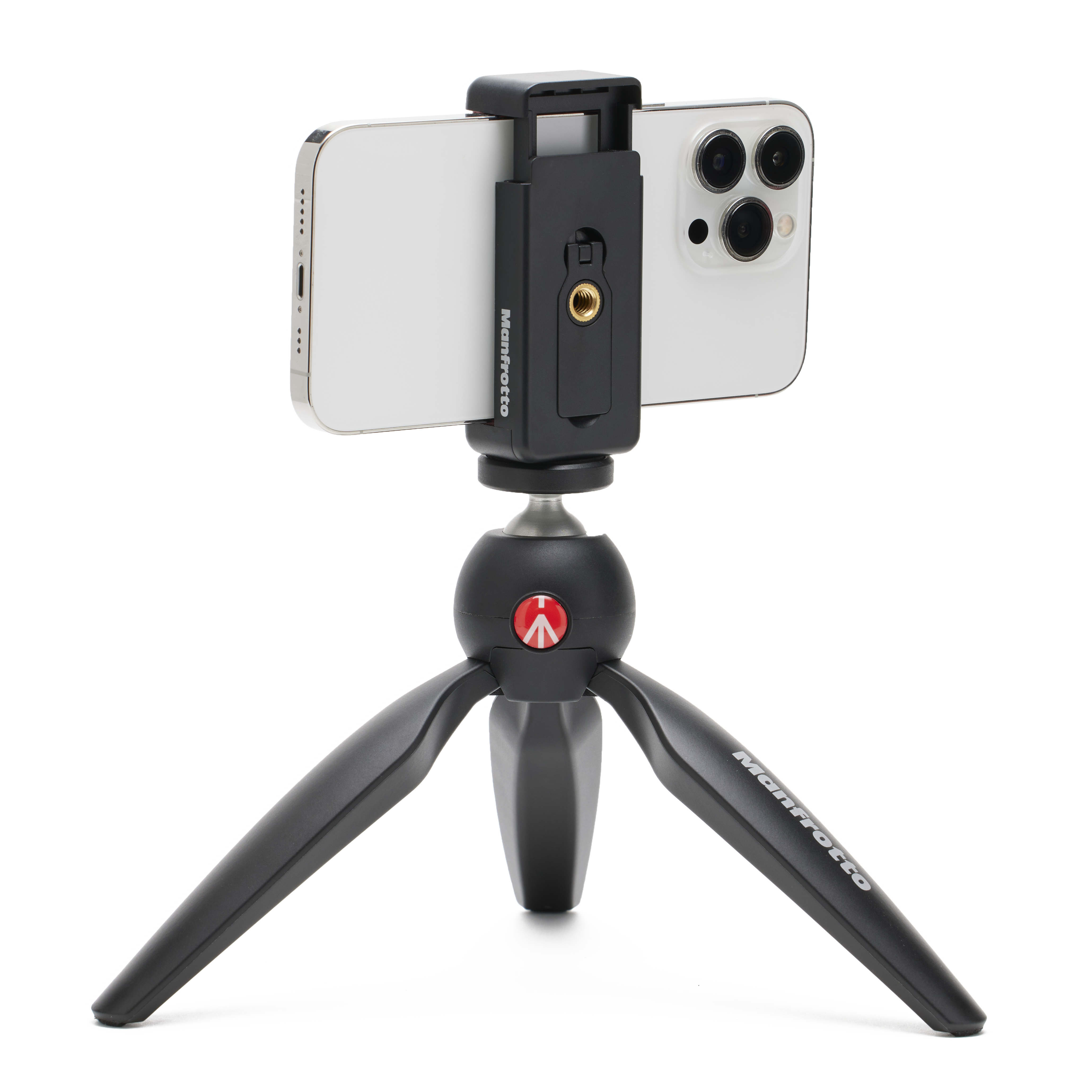 Ein Telefon ist auf einem Mini-Stativ montiert, wobei das Manfrotto-Logo auf dem Stativ sichtbar ist.