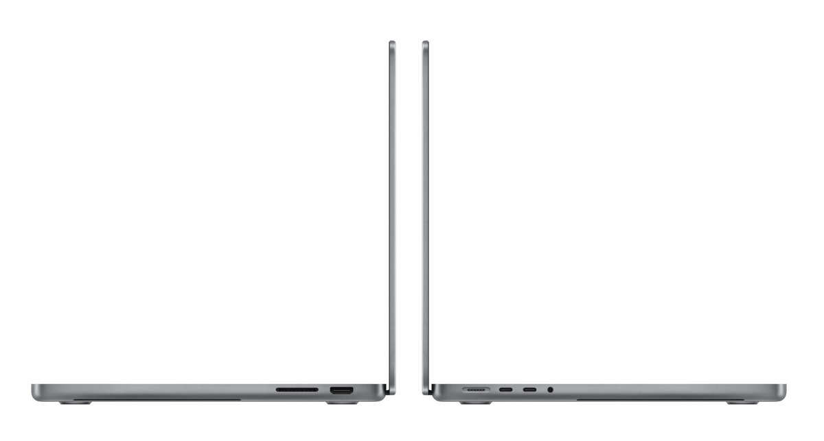 Dwa laptopy obok siebie. Srebrny kolor. Białe tło.