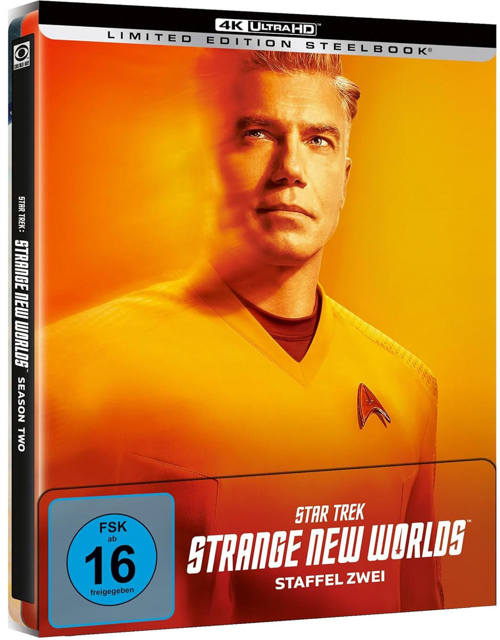 Ein 4K Ultra HD Steelbook von Star Trek: Strange New Worlds. Das Cover zeigt einen Mann in gelber Uniform.