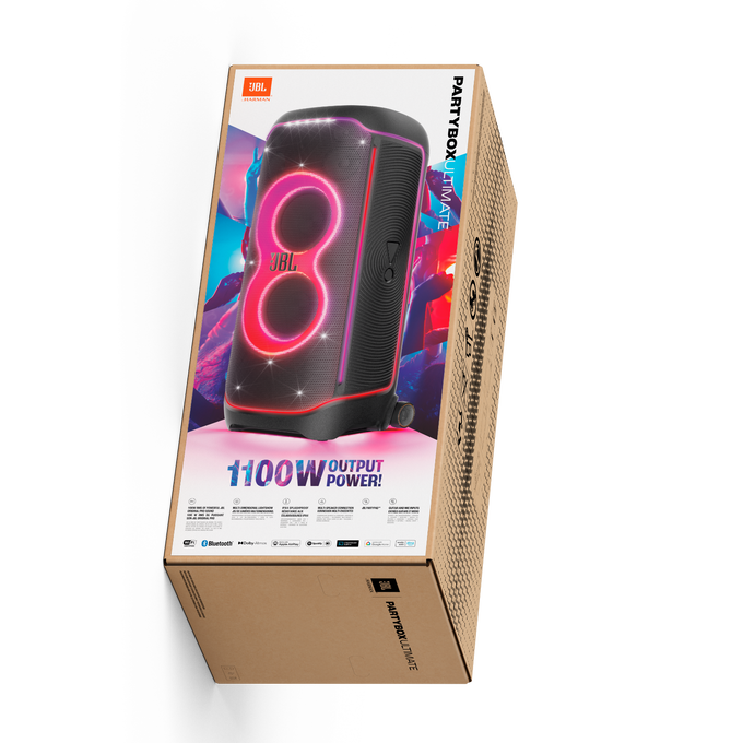 JBL PartyBox Ultimate hoparlör karton kutuda, açılı görünüm. Renkli ışıklar ve 1100W güç.