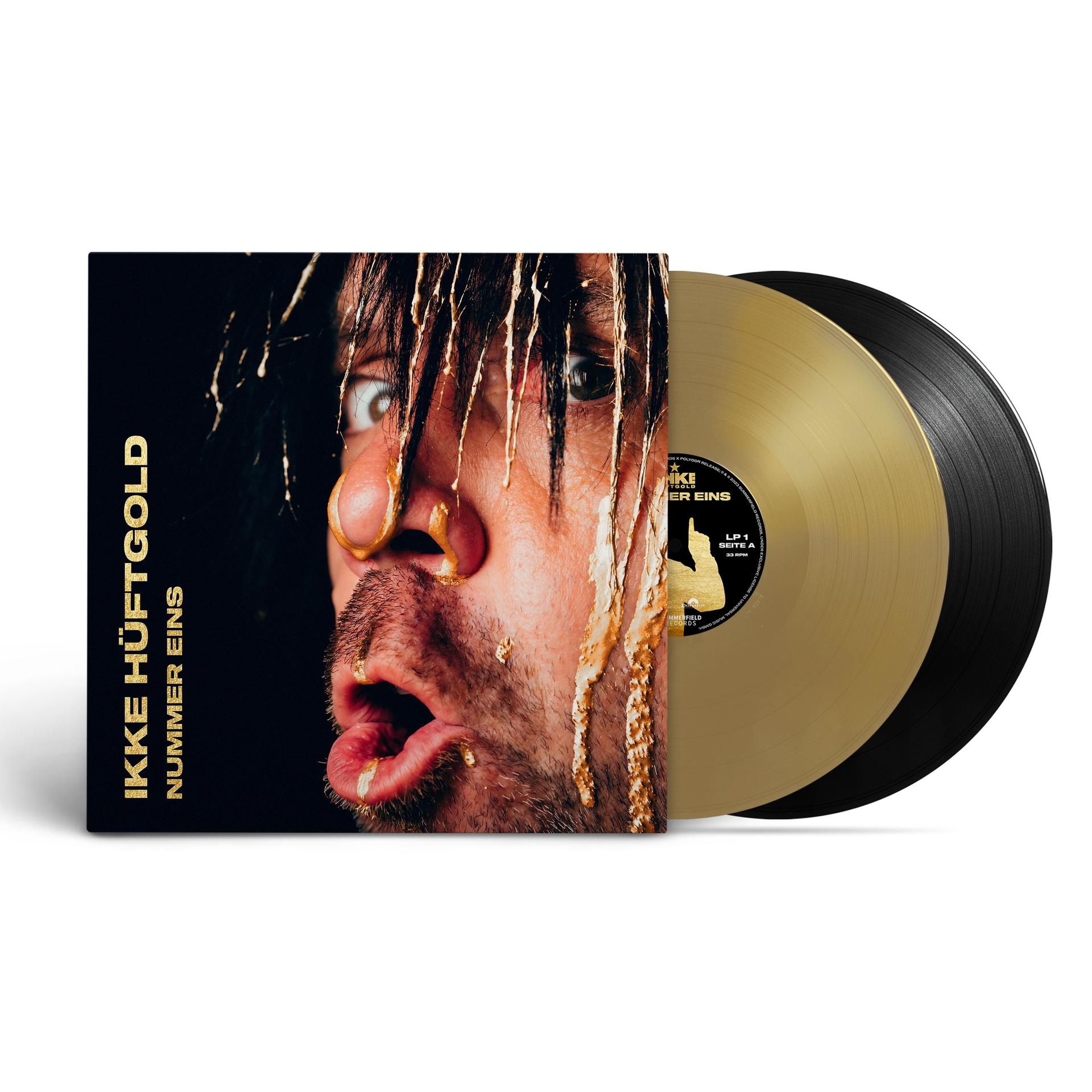 Albumcover mit einem Mann mit Essen im Gesicht, zwei Vinylplatten daneben.