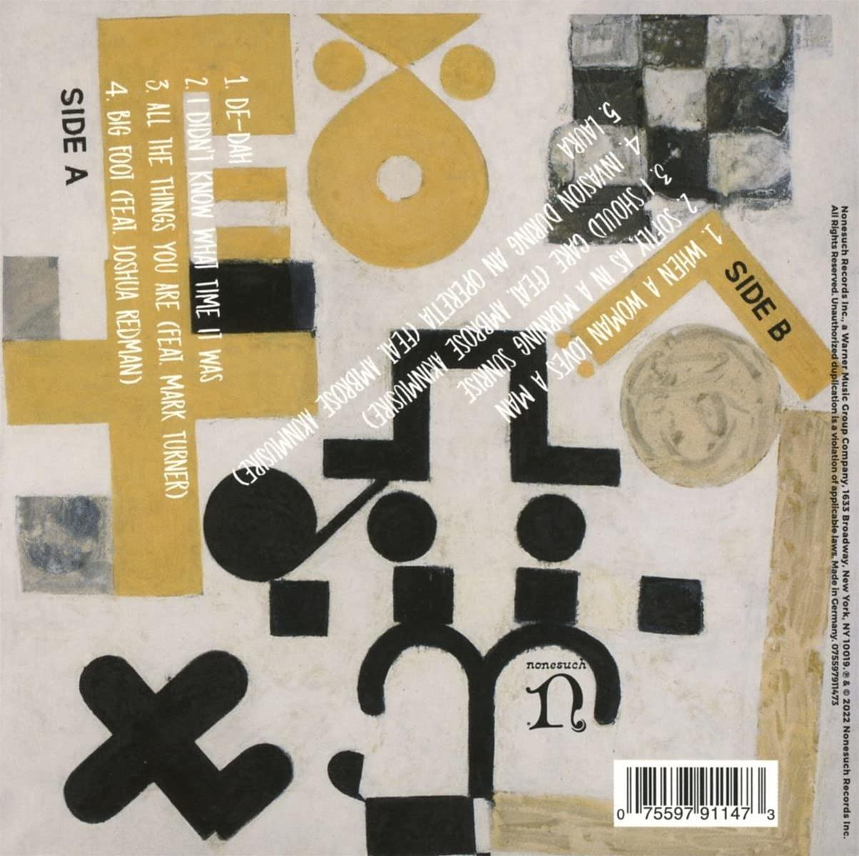 Albumcover mit abstrakten Formen, gelben und schwarzen Farben und Text. Seite A und B Beschriftungen sichtbar.