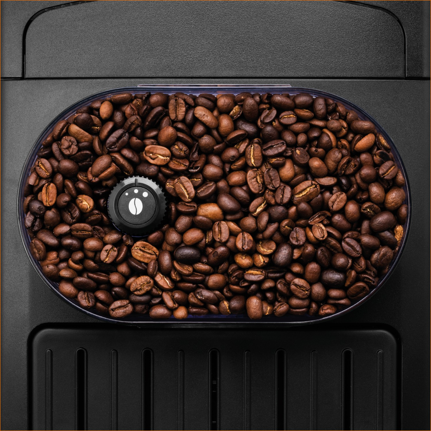 A container filled with coffee beans on a black coffee machine.