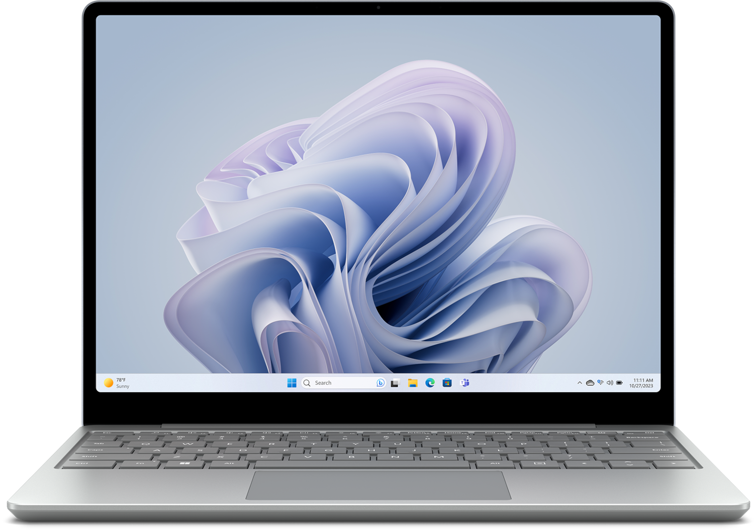 Un ordinateur portable argenté affichant un fond d'écran Windows 11 coloré. L'heure est 11h11.
