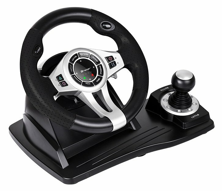 Kierownica i dźwignia zmiany biegów. Czarna i srebrna, z przyciskami i joystickiem na czarnej podstawie.