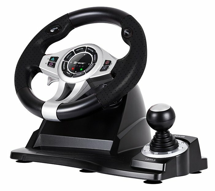 Czarna i srebrna kierownica z przyciskami i dźwignią zmiany biegów na czarnej podstawie.