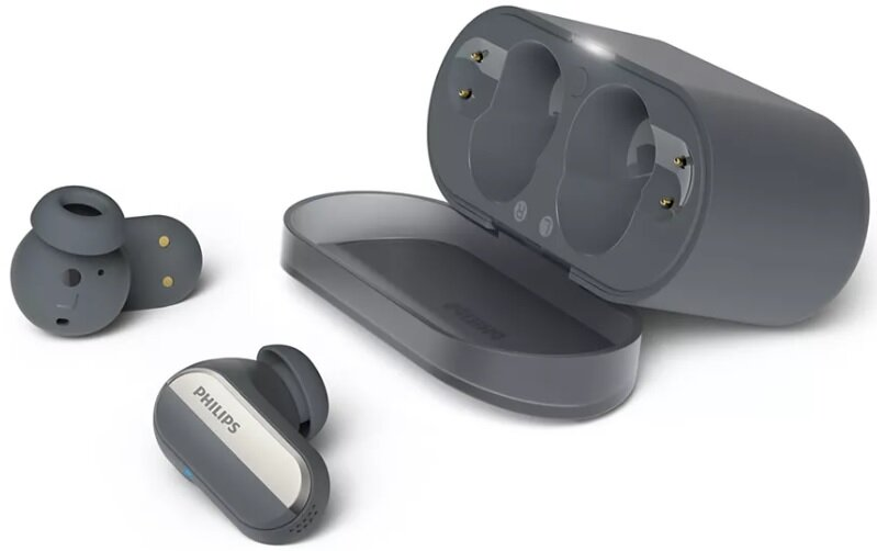 Bezprzewodowe słuchawki i etui ładujące. Słuchawki szare i czarne. Szare etui.