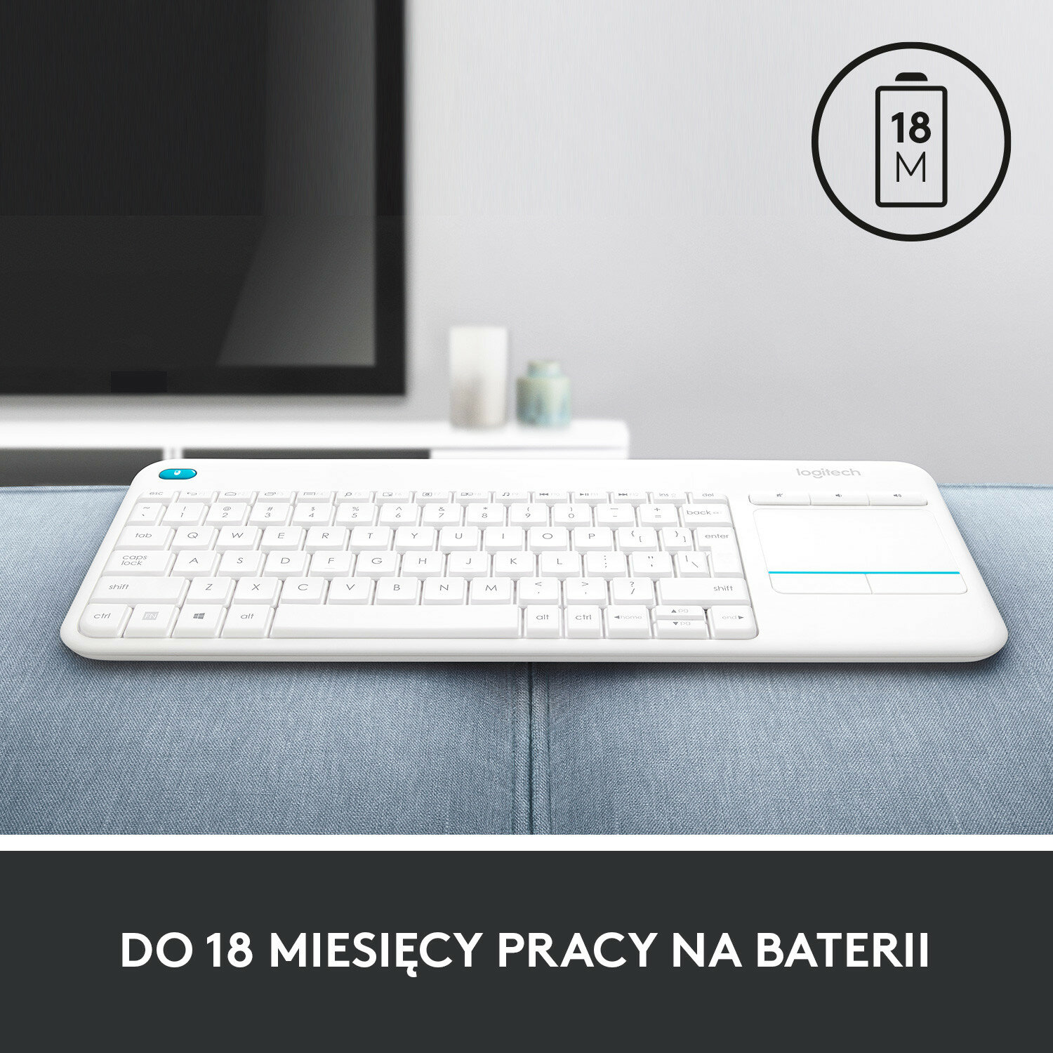 Biała klawiatura z panelem dotykowym i wskaźnikiem baterii u góry.