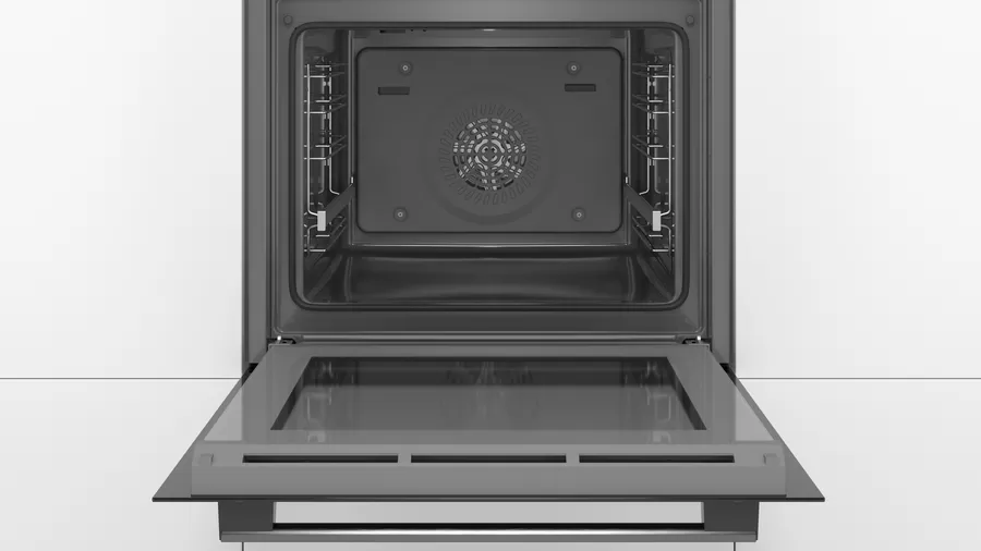 Otwarty wnętrze piekarnika z dwoma rusztami i wentylatorem. Drzwi piekarnika są otwarte, z przezroczystym szklanym panelem.