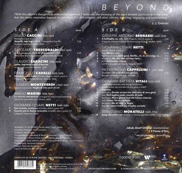 Ein Schallplattenlabel mit Text, darunter eine Liste von Songs, Künstlernamen und Credits auf dunklem Hintergrund.