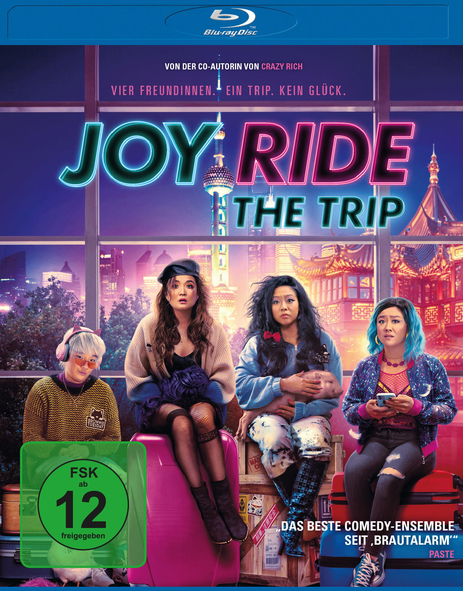 Filmcover für Joy Ride. Vier Frauen sitzen auf Gepäck vor einer Skyline.