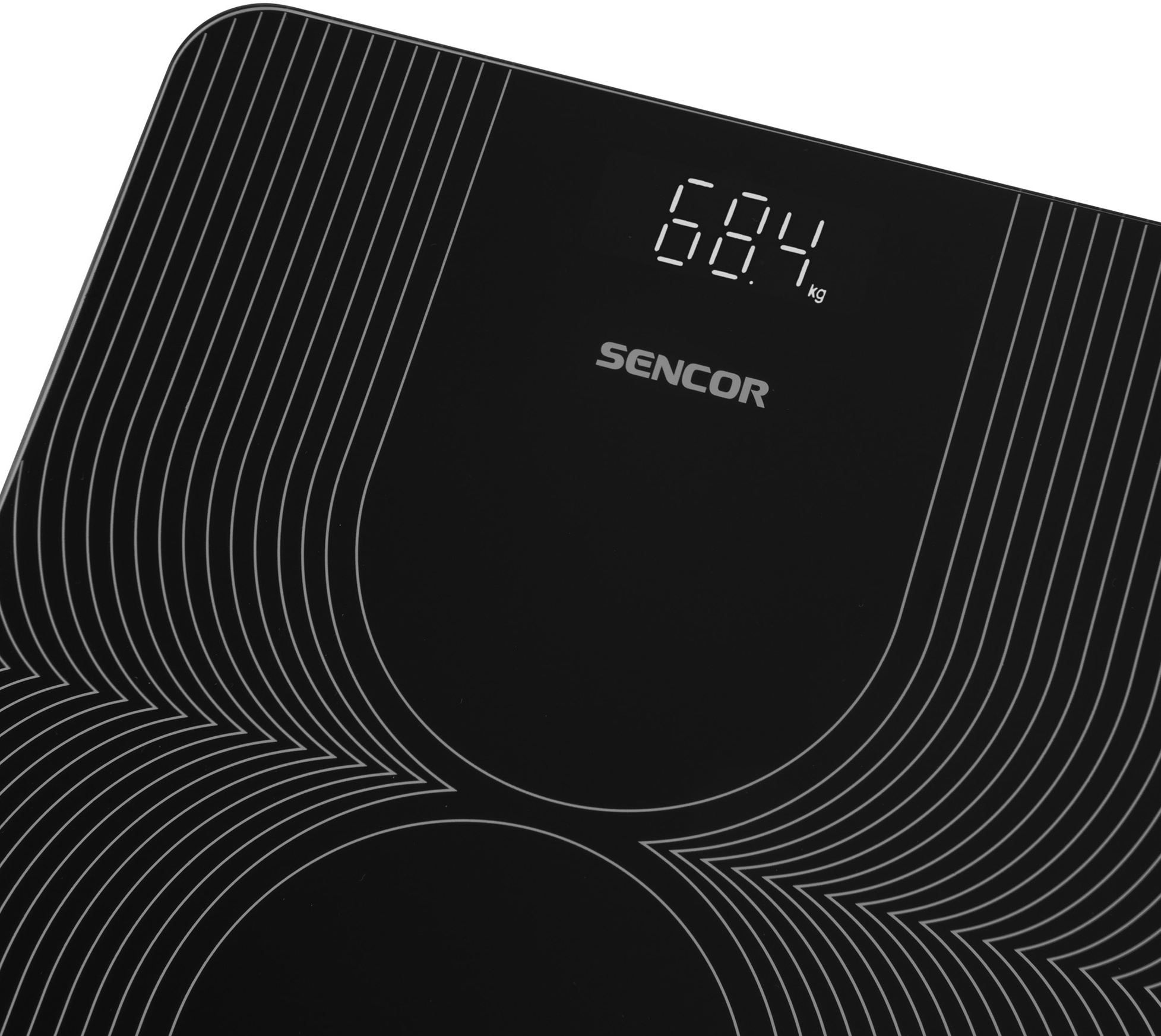Fekete digitális mérleg 68,4 kg-ot mutat. A mérleg fekete felületű, mintázattal.