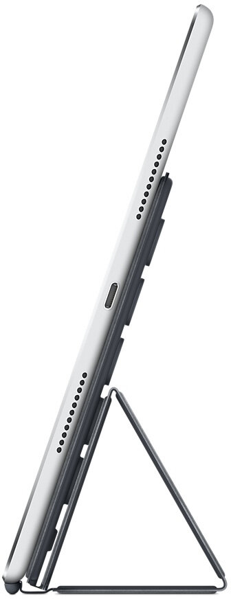 Widok z boku tabletu podpartego przez ciemnoszarą osłonę.