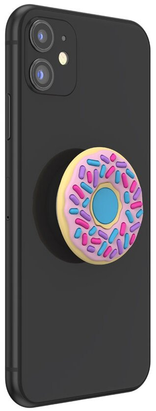 Czarny telefon z dołączonym uchwytem na telefon w kształcie pączka, z różową polewą i posypką.